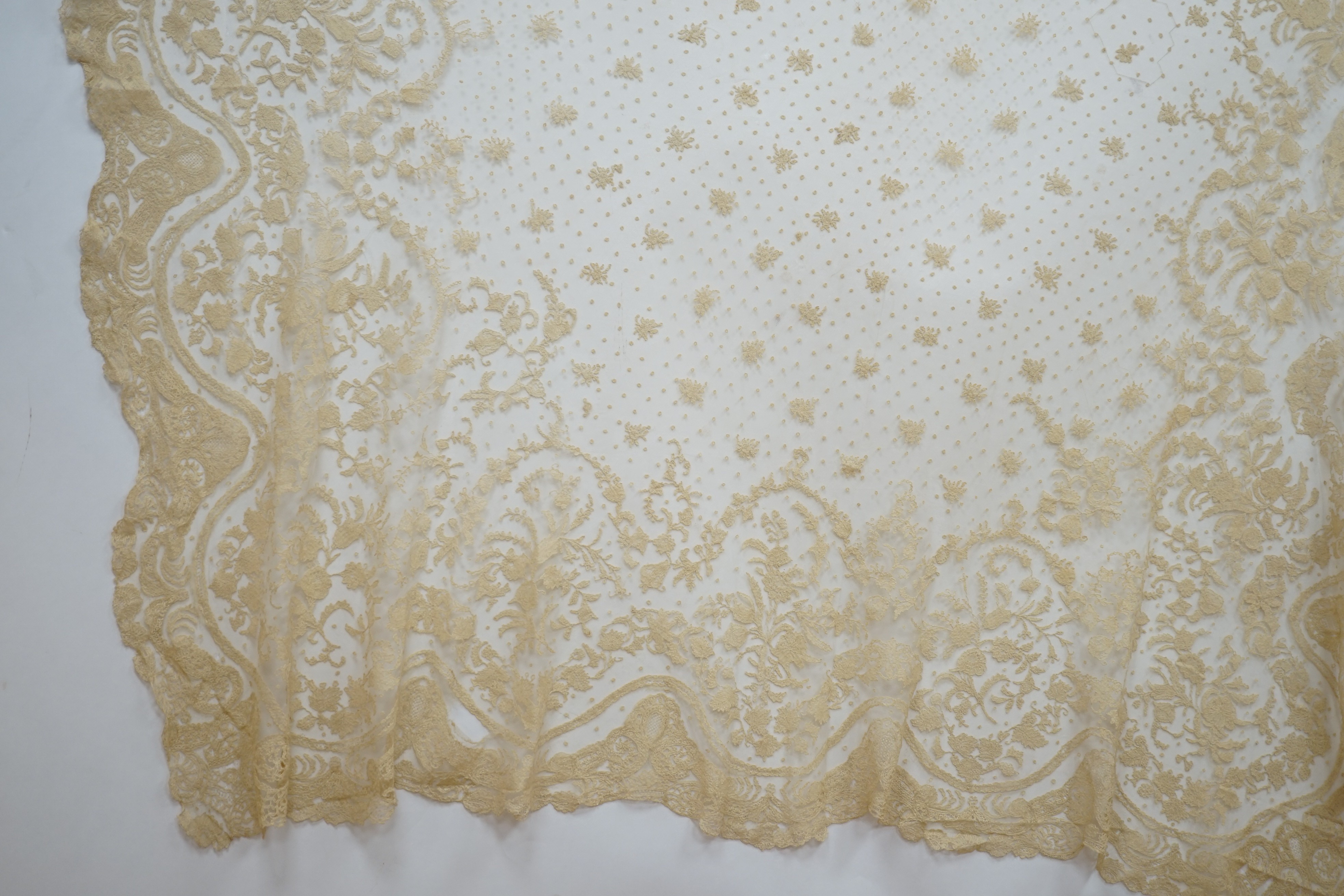 A rare length (9 and a half yards) of Brussels 19th century needle lace, some repairs and damage, circa 1880 and a similar wedding veil